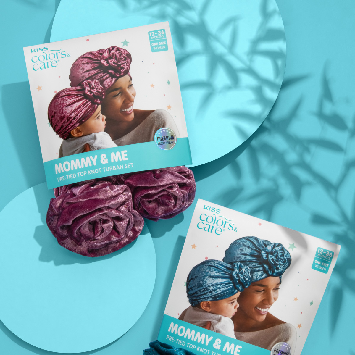 KISS Colors & Care Mommy & Me Pre-Tied Top Knot Turban Sets in crushed velvet, blue and purple, shown in packaging with a mother and baby wearing matching turbans.