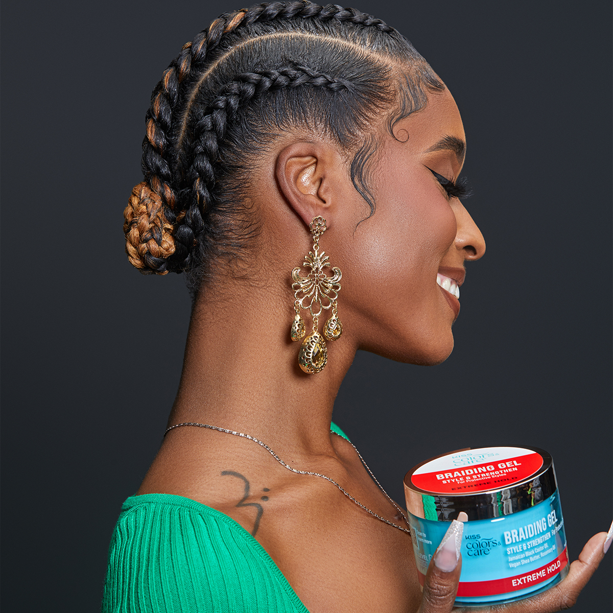 Side view of a woman with shiny, healthy looking braids, holding onto KISS Colors & Care Braiding Gel in Extreme Hold.