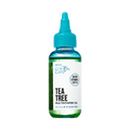 Clear plastic bottle with teal twist cap containing green liquid. Label reads "KISS Colors &amp; Care Tea Tree Multivitamin Oil," boosted with biotin and vitamin E, for dry and irritated skin.