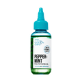 Clear green bottle with teal dropper cap labeled "KISS Colors &amp; Care Peppermint Multivitamin Oil," highlighting biotin and vitamin E, and stating "To Stimulate &amp; Refresh."