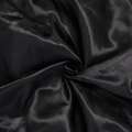 Black silky satin fabric with a smooth, shiny texture gathered in a swirl pattern, representing the bonnet cap material.