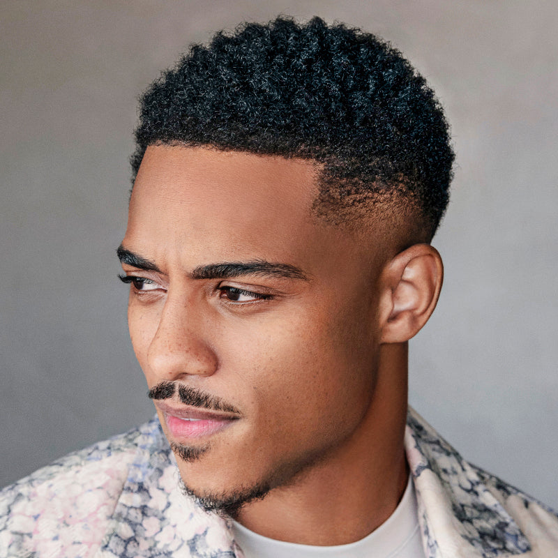 Close up of actor and model Keith Powers hair styled with Twist King Sponge and soft hold Twist Curl Gel.