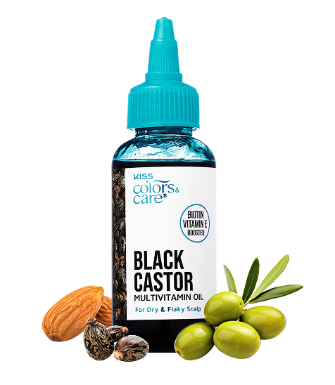 Clear plastic bottle with blue squeeze cap labeled "Kiss Colors & Care Black Castor Multivitamin Oil" with text "Biotin Vitamine Boosted" and "For Dry & Flaky Scalp," surrounded by almonds, castor seeds, and green olive…